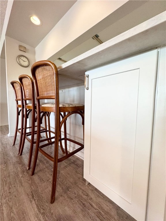 dining area featuring dark wood-type flooring