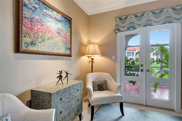 living area featuring light tile patterned floors, french doors, and ornamental molding