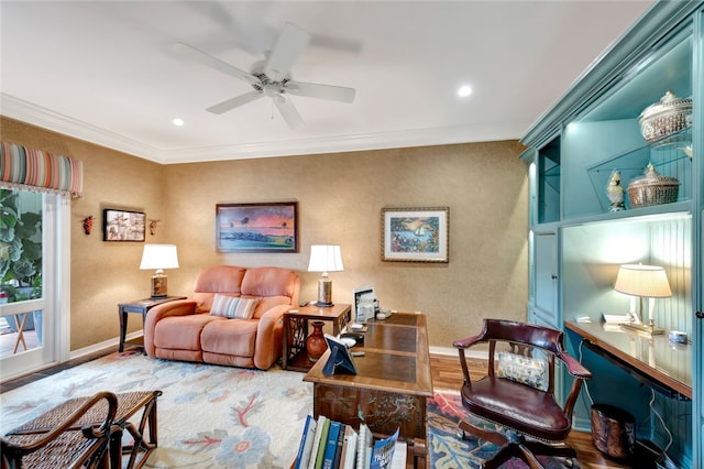 living room featuring hardwood / wood-style floors, ceiling fan, and ornamental molding