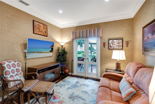 living room with wood-type flooring, crown molding, and french doors