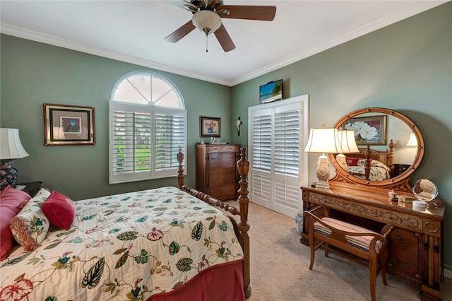 bedroom with ceiling fan, ornamental molding, and light colored carpet