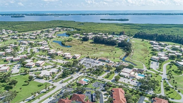 62 Woodland Dr Unit 201, Vero Beach, FL 32962 - aerial overview of property's location with a large body of water and nearby suburban area