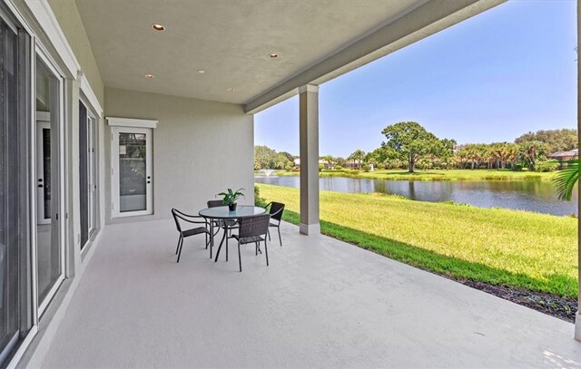 view of patio / terrace featuring a water view