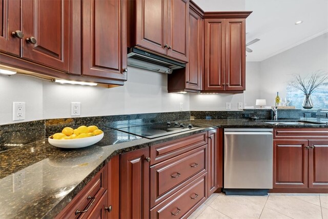 kitchen featuring dark stone countertops, dishwasher, light tile patterned floors, and electric stovetop