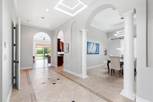 interior space featuring ceiling fan, ornamental molding, and light tile patterned floors