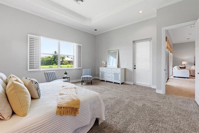 carpeted bedroom with crown molding