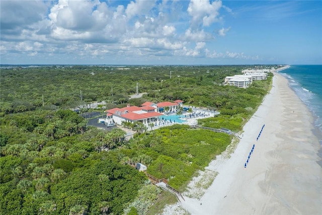 drone / aerial view featuring a water view and a beach view