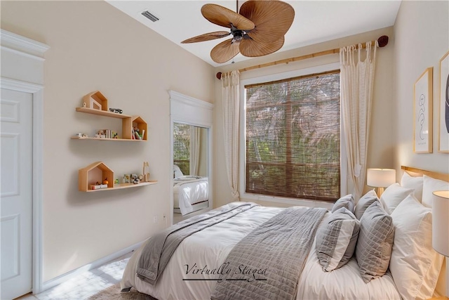 bedroom with visible vents and a ceiling fan