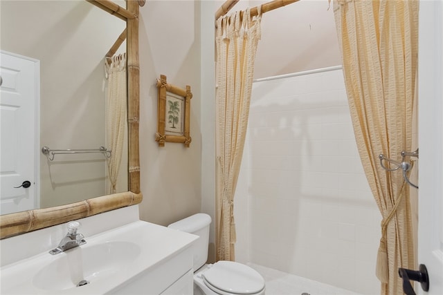 bathroom with vanity, toilet, and curtained shower