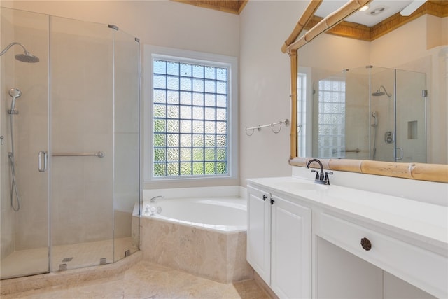 full bathroom featuring vanity, a shower stall, and a bath