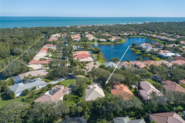 bird's eye view with a residential view and a water view