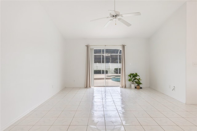 empty room featuring ceiling fan and light tile patterned flooring