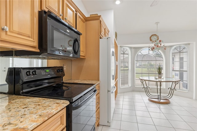 kitchen with light stone countertops, light tile patterned floors, black appliances, and an inviting chandelier