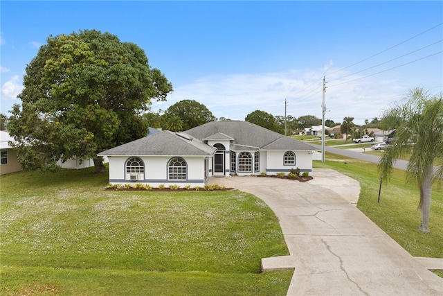 ranch-style house featuring a front lawn