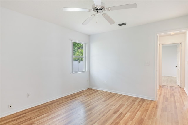 unfurnished room featuring ceiling fan and light hardwood / wood-style flooring