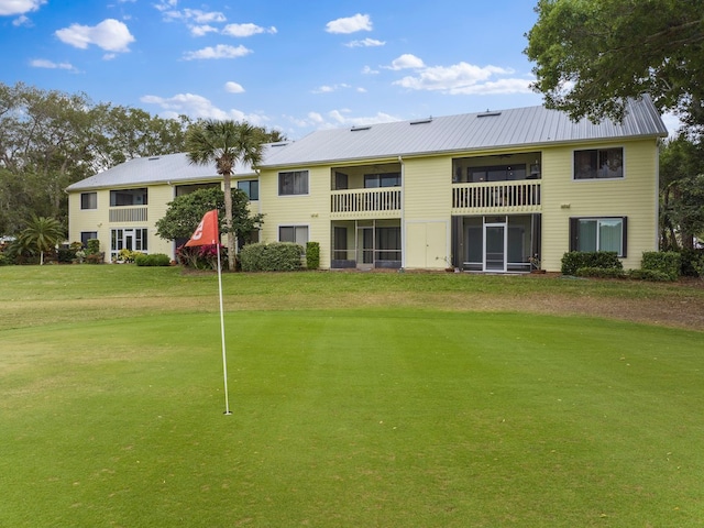 view of home's community featuring a lawn