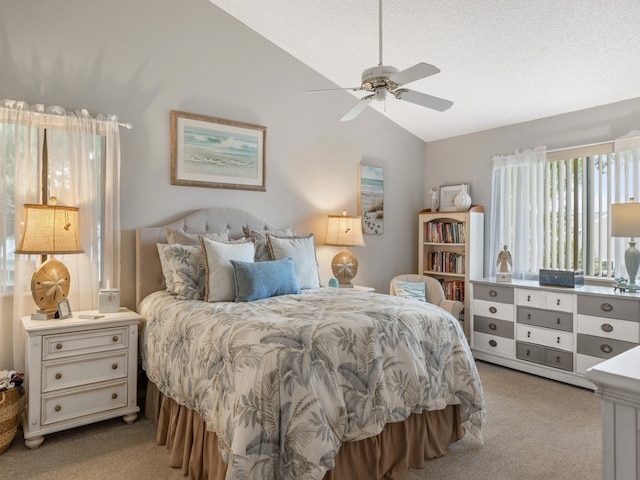 carpeted bedroom with lofted ceiling and ceiling fan