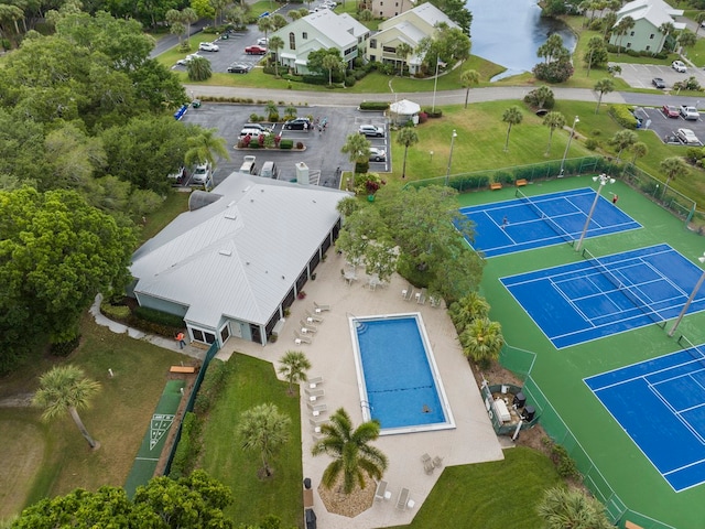 birds eye view of property with a water view