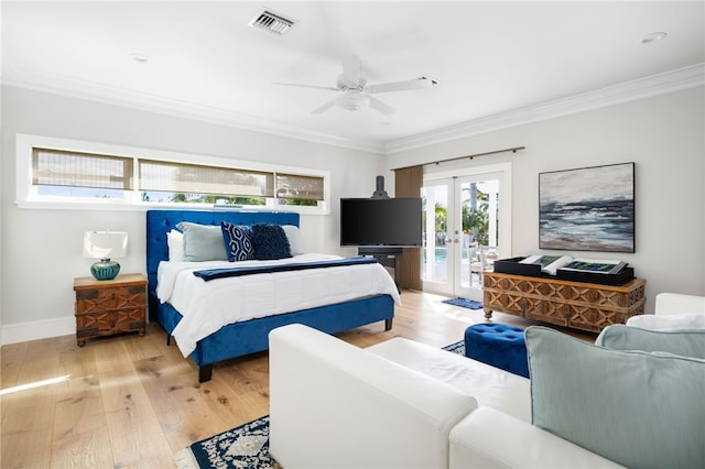 bedroom with access to outside, crown molding, light wood finished floors, french doors, and baseboards
