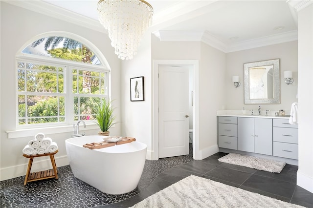 full bathroom featuring ornamental molding, plenty of natural light, a chandelier, vanity, and toilet