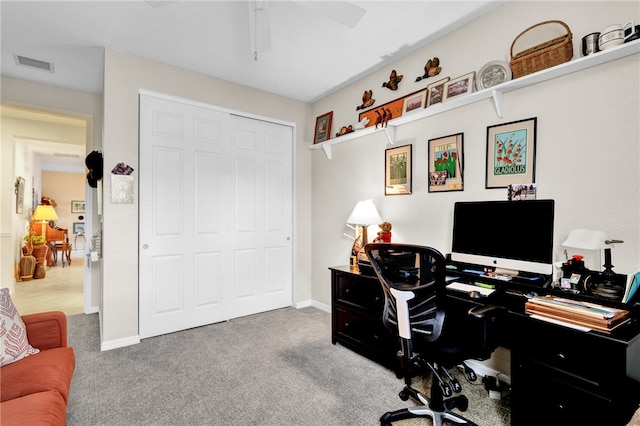 carpeted office with ceiling fan