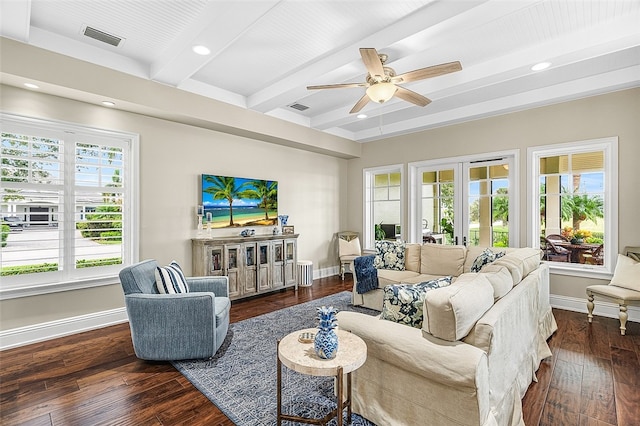 living room with ceiling fan, beamed ceiling, and dark hardwood / wood-style floors