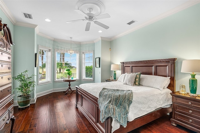 bedroom featuring dark hardwood / wood-style floors, ceiling fan, and crown molding