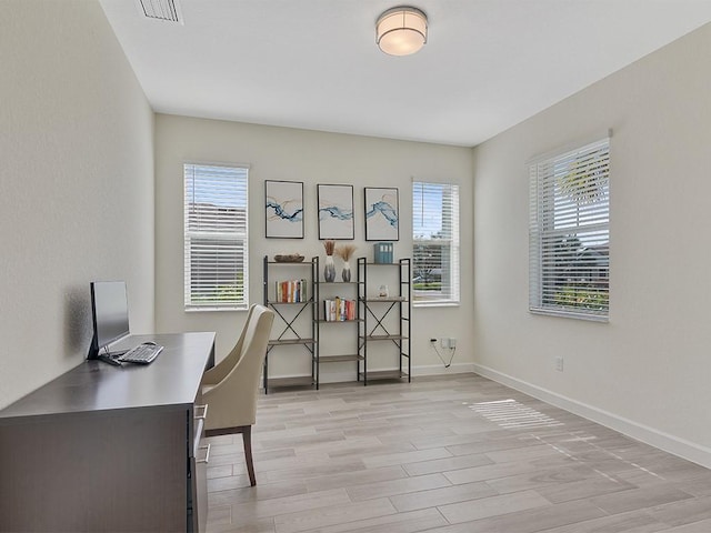 office space with light hardwood / wood-style flooring