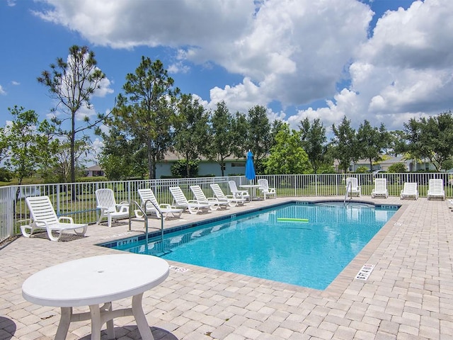 view of swimming pool featuring a patio