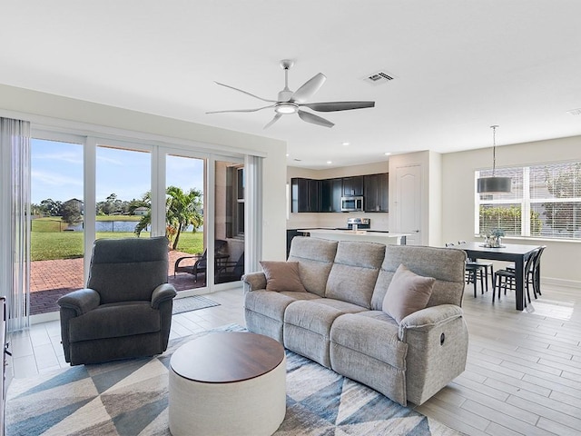 living room featuring ceiling fan