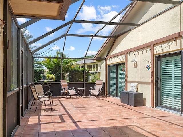 view of patio with a lanai