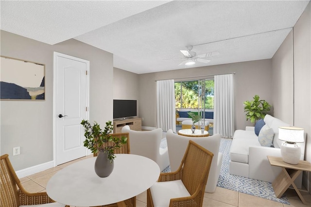 1901 Indian River Blvd Unit 202D, Vero Beach, FL 32960 - dining space with light tile patterned floors, ceiling fan, and a textured ceiling