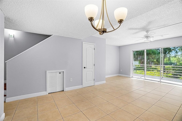 1901 Indian River Blvd Unit 202D, Vero Beach, FL 32960 - empty room featuring a textured ceiling, a chandelier, a ceiling fan, and light tile patterned flooring