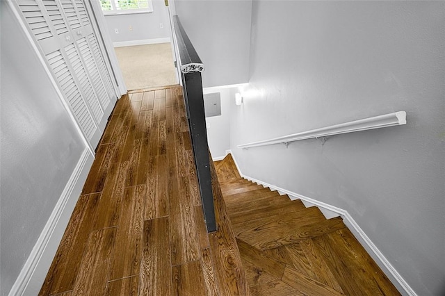 1901 Indian River Blvd Unit 202D, Vero Beach, FL 32960 - staircase with baseboards and wood finished floors