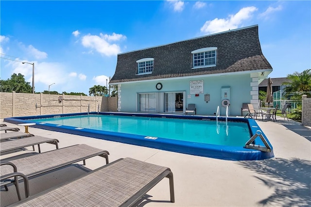 1901 Indian River Blvd Unit 202D, Vero Beach, FL 32960 - community pool with a patio area, an outdoor structure, and a storage structure