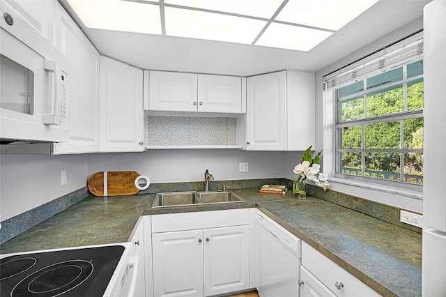 1901 Indian River Blvd Unit 202D, Vero Beach, FL 32960 - kitchen with white appliances, white cabinetry, dark countertops, and open shelves