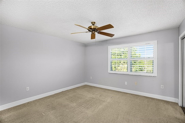 1901 Indian River Blvd Unit 202D, Vero Beach, FL 32960 - spare room featuring ceiling fan, carpet flooring, and a textured ceiling