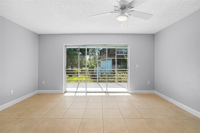 1901 Indian River Blvd Unit 202D, Vero Beach, FL 32960 - spare room with a ceiling fan, light tile patterned floors, and a textured ceiling