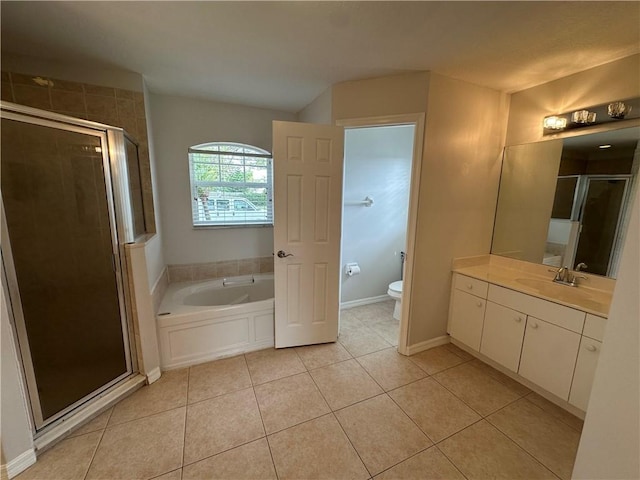 bathroom with tile patterned floors, a shower stall, toilet, and vanity