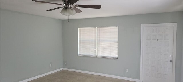 unfurnished room featuring ceiling fan and light tile patterned floors