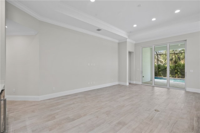 unfurnished room featuring ornamental molding and light hardwood / wood-style floors