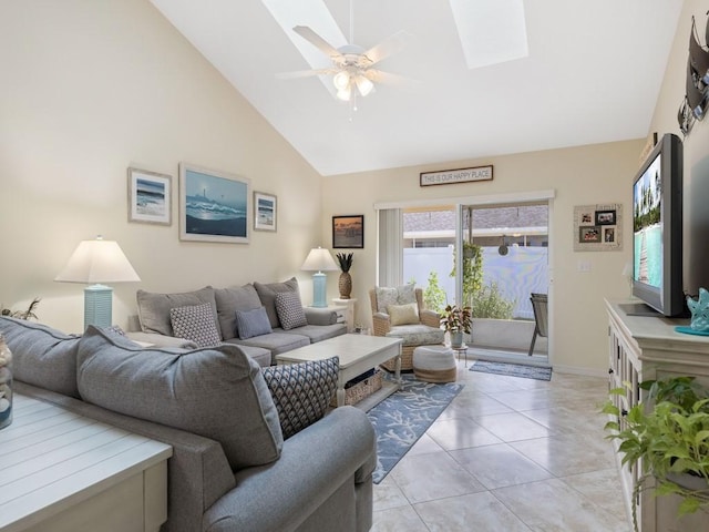 497 7th St, Vero Beach, FL 32962 - living area featuring a ceiling fan, high vaulted ceiling, a skylight, light tile patterned flooring, and baseboards