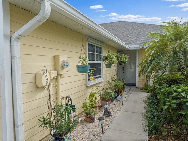497 7th St, Vero Beach, FL 32962 - doorway to property featuring a shingled roof