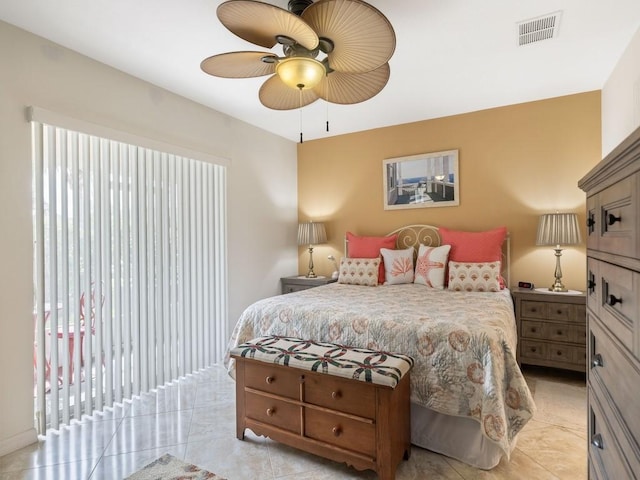 bedroom featuring light tile patterned floors and ceiling fan