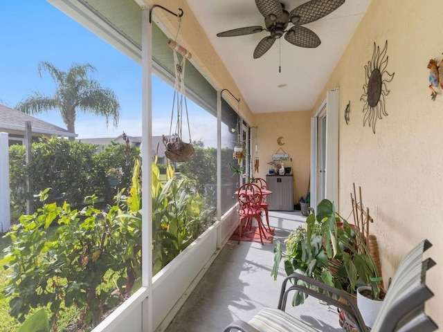 497 7th St, Vero Beach, FL 32962 - sunroom / solarium with finished concrete floors, ceiling fan, and a textured wall