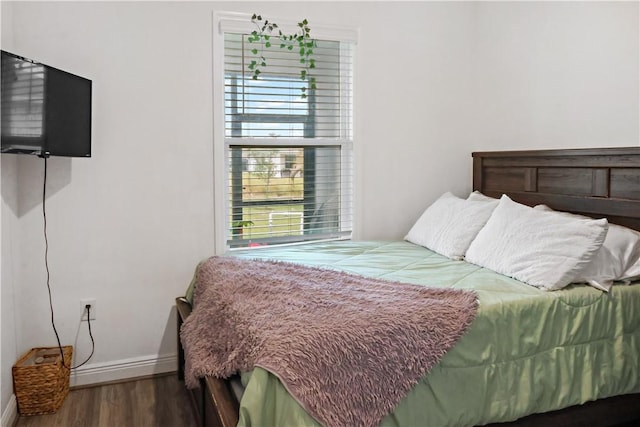 4308 Lago Vista Dr, Sebastian, FL 32976 - bedroom with wood finished floors, multiple windows, and baseboards