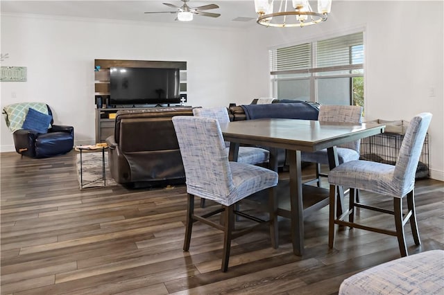 4308 Lago Vista Dr, Sebastian, FL 32976 - dining room with a chandelier, wood finished floors, a ceiling fan, ornamental molding, and baseboards