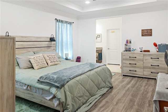 4308 Lago Vista Dr, Sebastian, FL 32976 - bedroom with wood finished floors, recessed lighting, a raised ceiling, crown molding, and connected bathroom