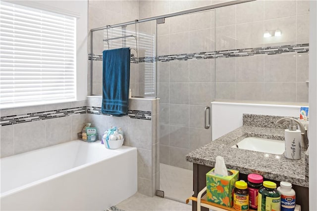 4308 Lago Vista Dr, Sebastian, FL 32976 - bathroom with a shower stall, a garden tub, and a sink