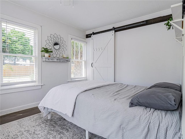 2047 38th Ave, Vero Beach, FL 32960 - bedroom with wood finished floors and a barn door